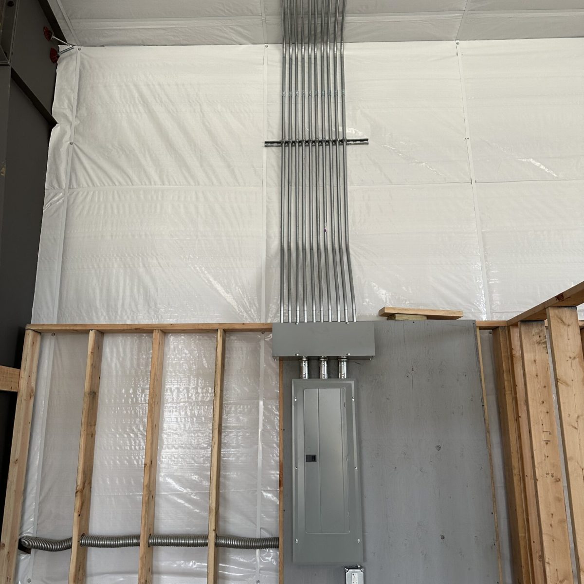 Licensed electrician inspecting electrical systems in Connecticut office building