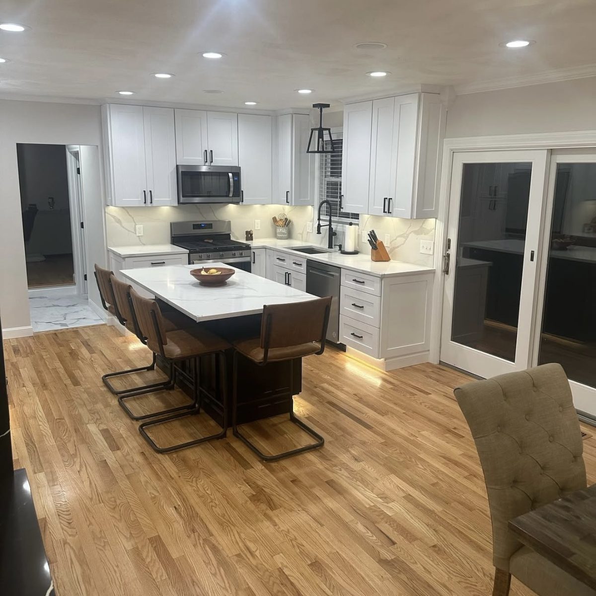 Kitchen ceiling lights, chandelier, and under-cabinet lighting installed in Connecticut by licensed electrician.